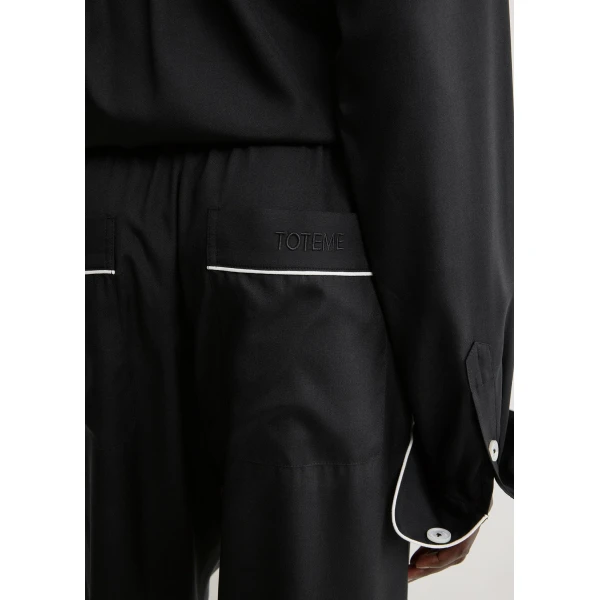 Totême Piped silk trousers in Black - Pants - Scandinavian Minimalist Luxury at Luxury Shoes 