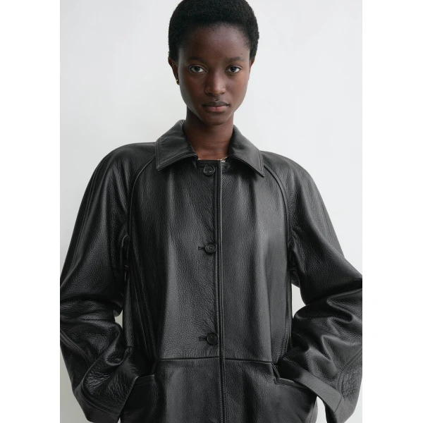 Totême Raglan-sleeve leather coat in Black - Coats - Scandinavian Minimalist Luxury at Luxury Shoes 