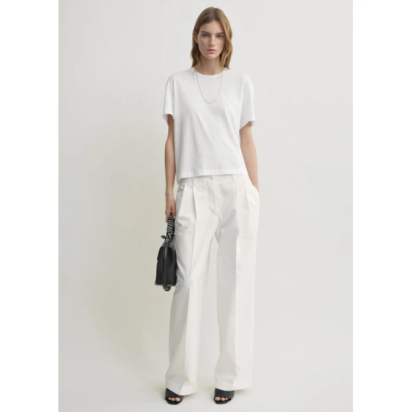 Totême Relaxed chino trousers in White - Pants - Scandinavian Minimalist Luxury at Luxury Shoes 