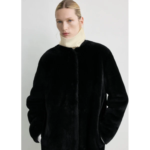Totême Shearling midi coat in Black - Coats - Scandinavian Minimalist Luxury at Luxury Shoes 