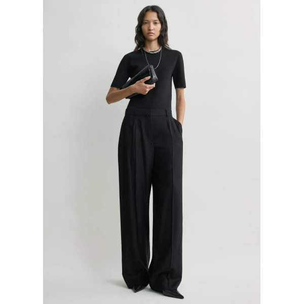Totême Wide flannel trousers in Black - Pants - Scandinavian Minimalist Luxury at Luxury Shoes 