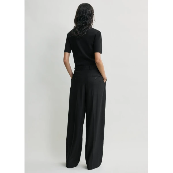 Totême Wide flannel trousers in Black - Pants - Scandinavian Minimalist Luxury at Luxury Shoes 
