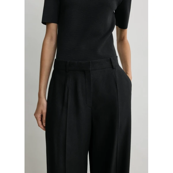 Totême Wide flannel trousers in Black - Pants - Scandinavian Minimalist Luxury at Luxury Shoes 