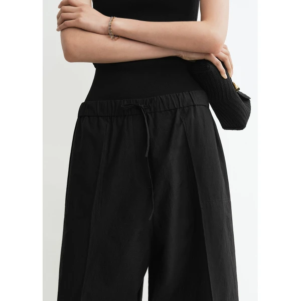 Totême Wide summer trousers in Black - Pants - Scandinavian Minimalist Luxury at Luxury Shoes 