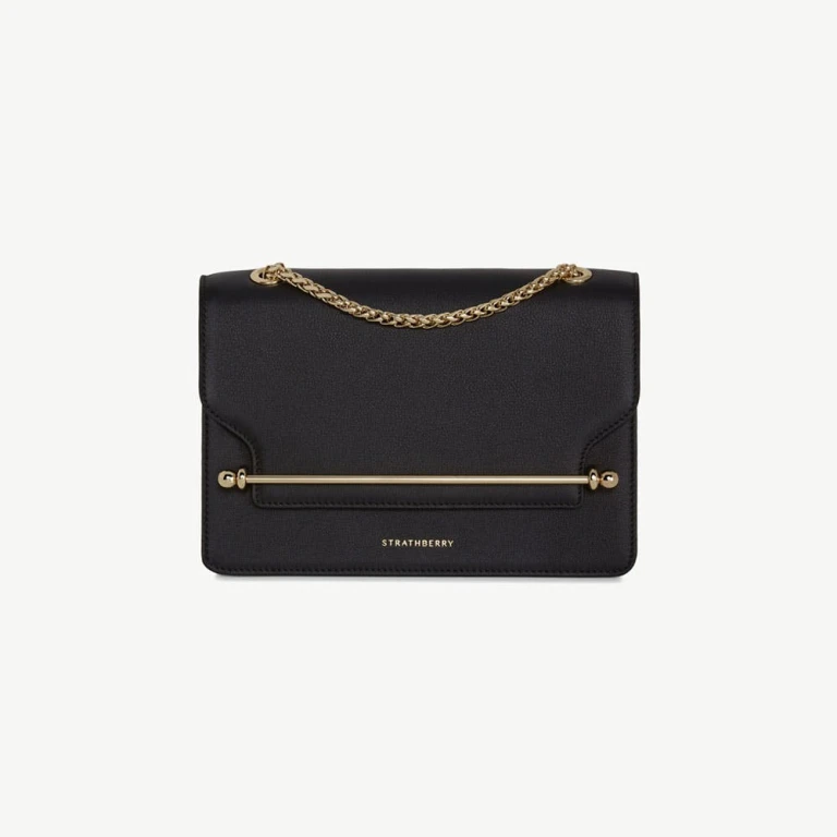 Strathberry East/West in black calf leather, the crossbody bag with the signature metal bar closure made globally known by Meghan Markle
