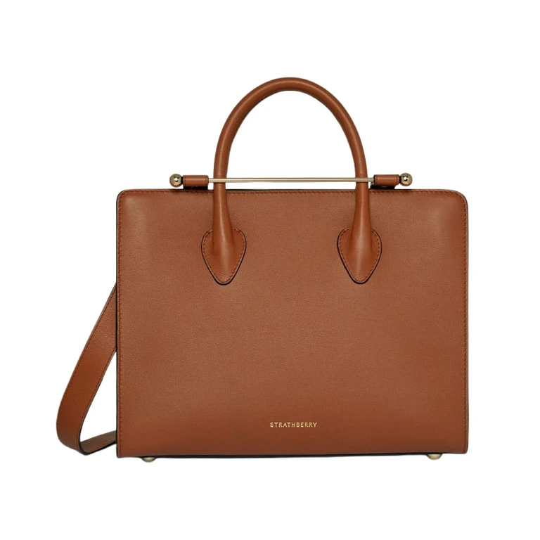 Strathberry Midi Tote in chestnut leather, a structured top-handle tote with the signature bar closure, an accessible-luxury alternative to DeMellier and Polene